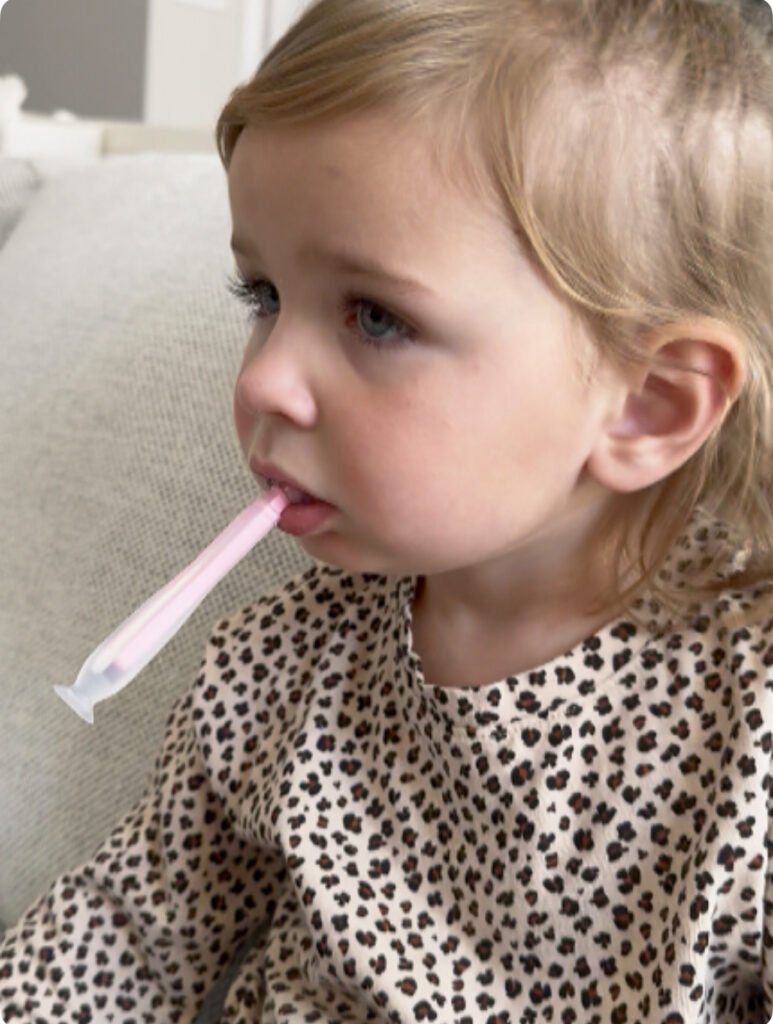 child practicing myofunctional therapy